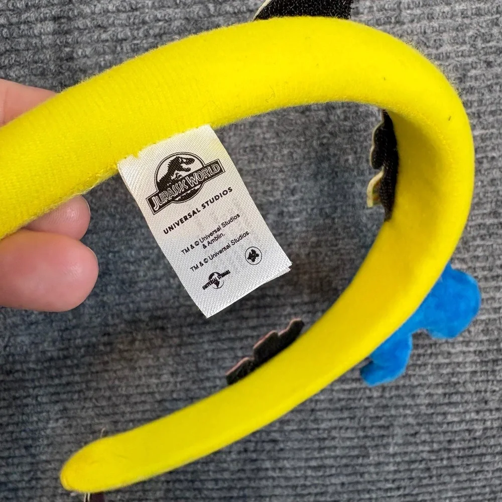 Jurassic World Universal Studios Dinosaur Headband Yellow Plush Triceratops NWT